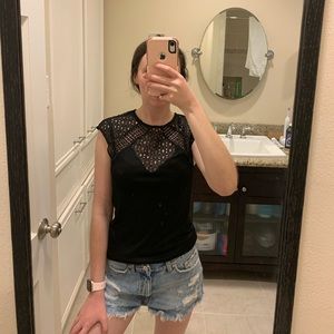 Fitted black top with crochet detail